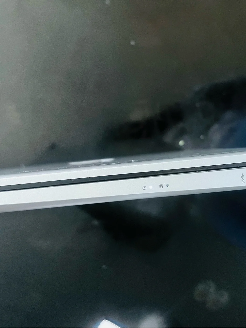 HP Silver Laptop with Blue Display and Dark Gray Keycaps